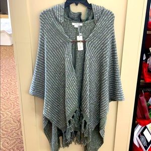 Hooded tassel wrap with leather snap closure